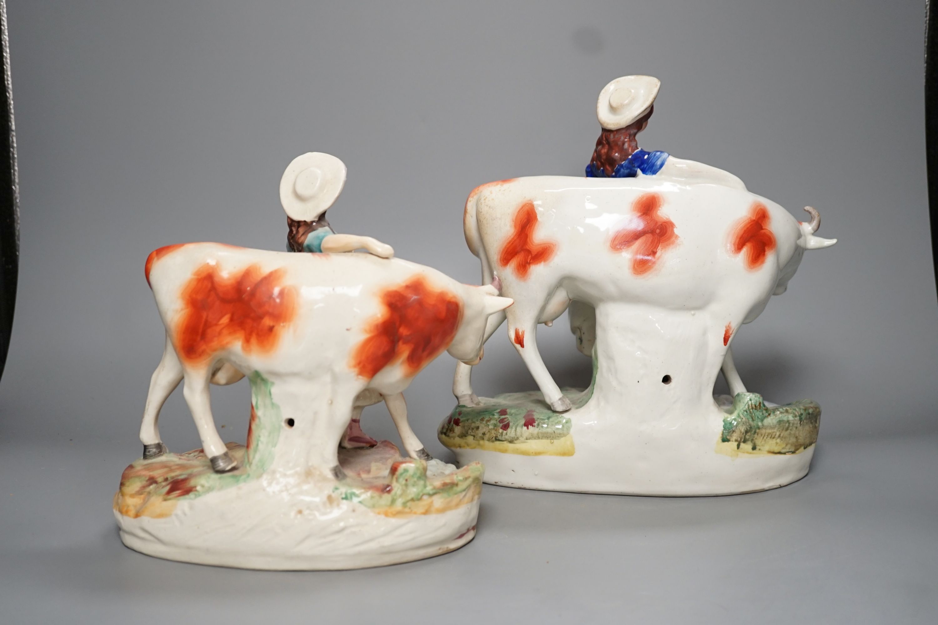 Two 19th century Staffordshire milk maid groups - tallest 24.5cm